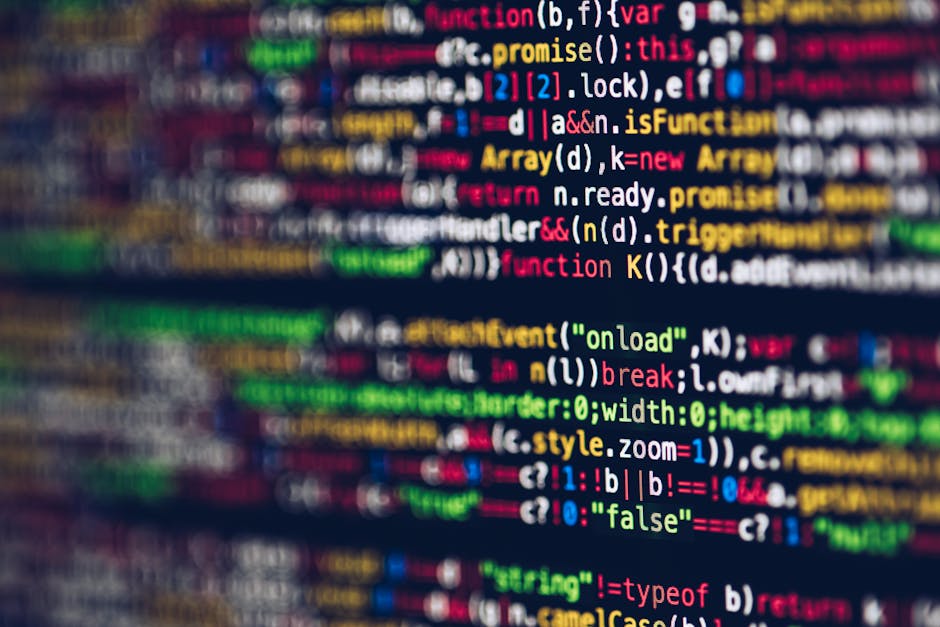 A close-up image of a computer screen displaying colorful lines of programming code, including keywords like 'function', 'var', 'promise', and 'onload', in various hues such as red, green, blue, yello