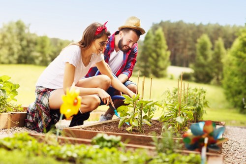 Chiswick gardener planting vibrant seasonal flowers